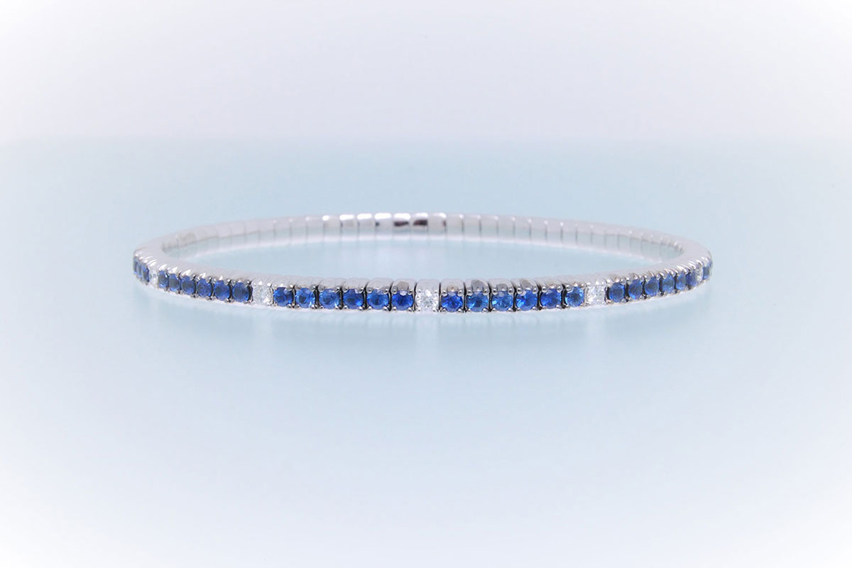 Bracciale tennis a molla oro bianco zaffiri e brillanti