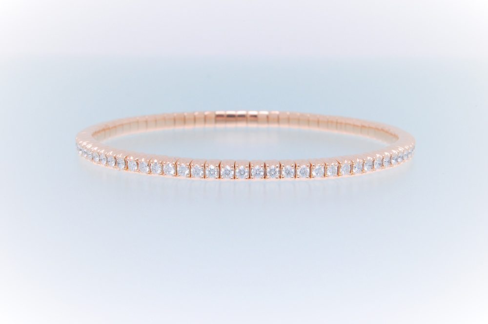 Bracciale tennis a molla oro rosa e diamanti