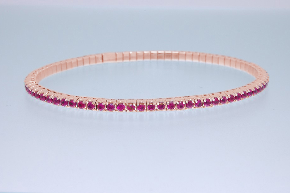 Bracciale tennis a molla oro rosa e rubini